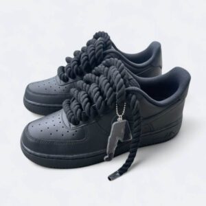 Sleek black Nike Air Force 1 sneakers with bold chunky laces, styled for a modern streetwear look