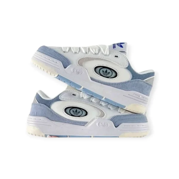 Adidas Adi2000 X Blue styled in pastel blue suede with bold black Adidas branding, chunky rubber sole, and classic 3-Stripes for a standout streetwear look