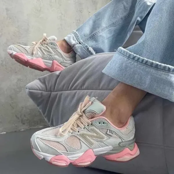 New Balance 9060 Baby Shower Blue styled on a woman wearing blue jeans, showcasing the sneaker’s Baby Shower Blue suede overlays, gold New Balance branding, and chunky ABZORB-cushioned sole