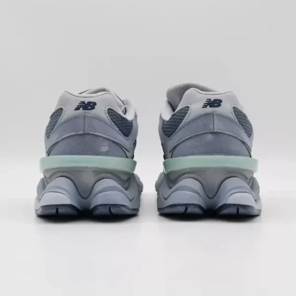 Back view of the New Balance 9060 Moon Daze, showcasing the padded heel collar, sculpted ABZORB-cushioned sole, and off-white suede overlays