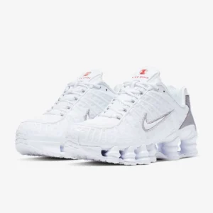Nike Shox TL ‘White’ sneaker on a clean backdrop, featuring white mesh upper, tonal TPU cage, full-length Shox columns, and sculpted midfoot shank