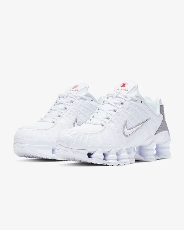 Nike Shox TL ‘White’ sneaker on a clean backdrop, featuring white mesh upper, tonal TPU cage, full-length Shox columns, and sculpted midfoot shank